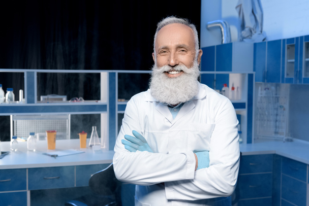 grey haired scientist with arms crossed - Photo, Image