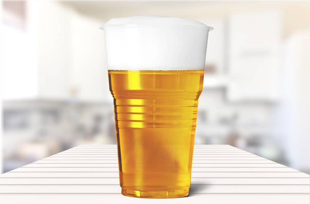 Plastic glass with beer - Foto, imagen