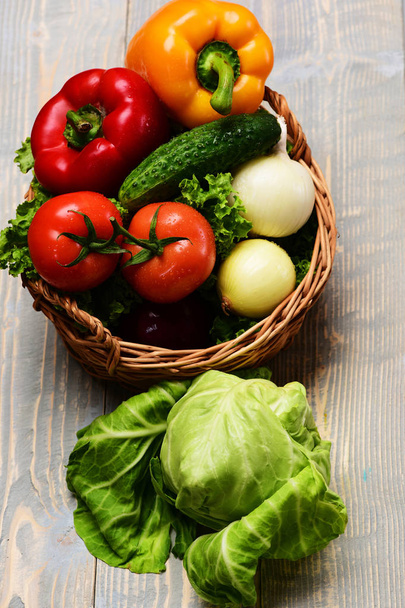 vegetables in basket on blue vintage wooden, eco food concept - Фото, зображення