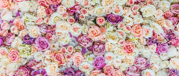 Flowers wall background with amazing red and white roses, Wedding decoration, hand made. Toning - Photo, Image