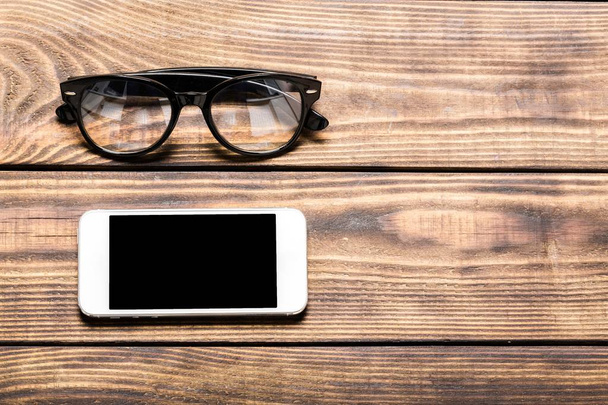 trendy eyeglasses and smartphone - Photo, image