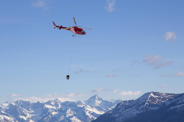 Helicopter Transporting Concrete - 写真・画像