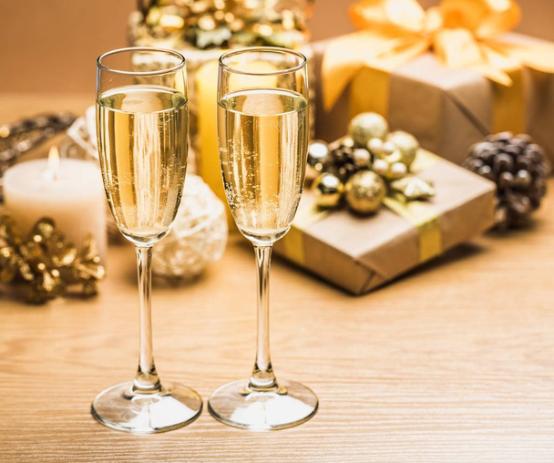 Champagne glasses with Christmas decorations - Фото, изображение