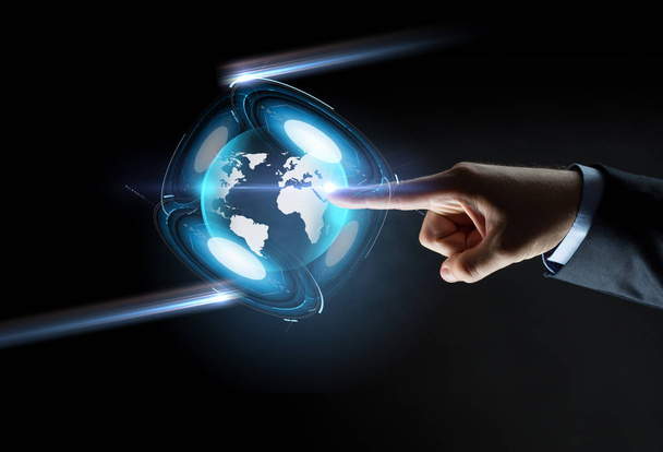hand pointing finger to virtual earth projection - Φωτογραφία, εικόνα