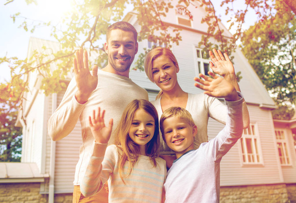 happy family in front of house outdoors - Foto, imagen