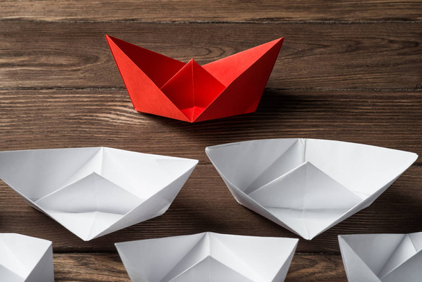 Set of origami boats on wooden table  - Фото, зображення