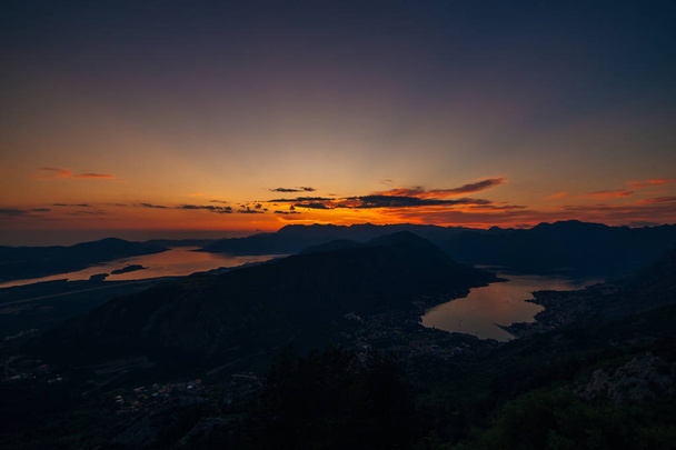 Sunset in Montenegro over the mountains and the sea - Photo, Image