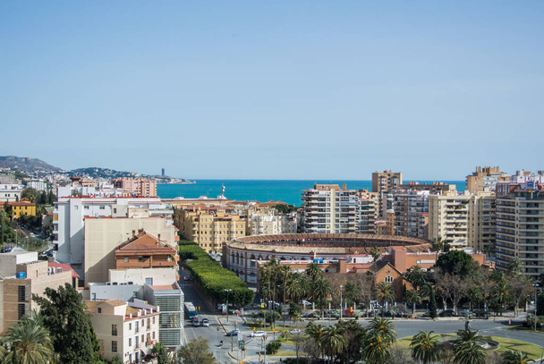 MALAGA, SPAIN - FEBRUARY 16, 2014: An iconic panoramic view from a castle of Malaga to the city and Mediterranean sea, Andalusia, Spain. - Foto, immagini