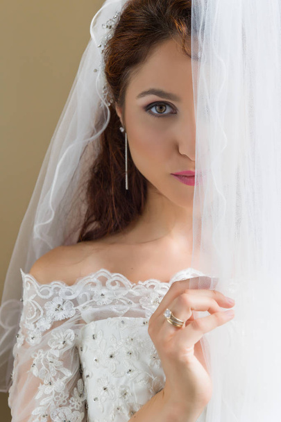 Shy bride behind curtains - Foto, Imagem