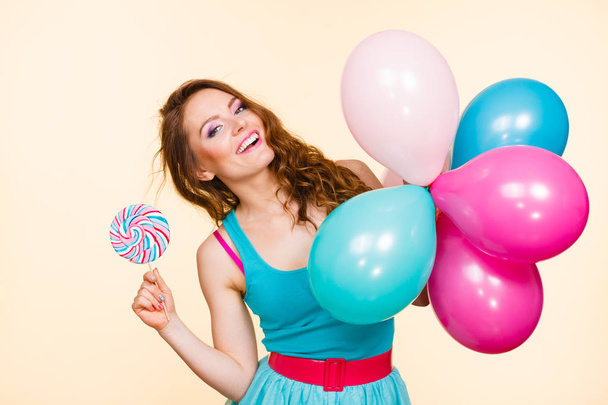 Woman with colorful balloons and lollipop - Foto, Imagen