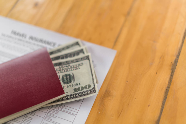 Blank passport with US dollars on wood table over Travel Aviatio - Фото, изображение