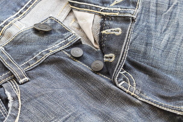 achtergrond textuur knoppen jeans broek denim stof - Foto, afbeelding