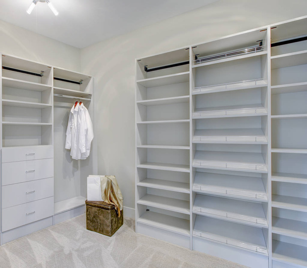 Empty walk-in closet with open shelves  - Photo, Image