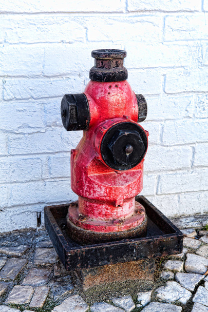 A closeup red fire hydrant on a street - Valokuva, kuva