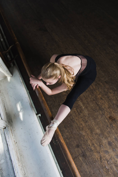 Female ballet dancer stretches - Photo, Image