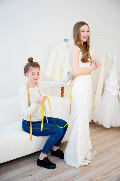 Bride with wedding assistant - Foto, Imagen
