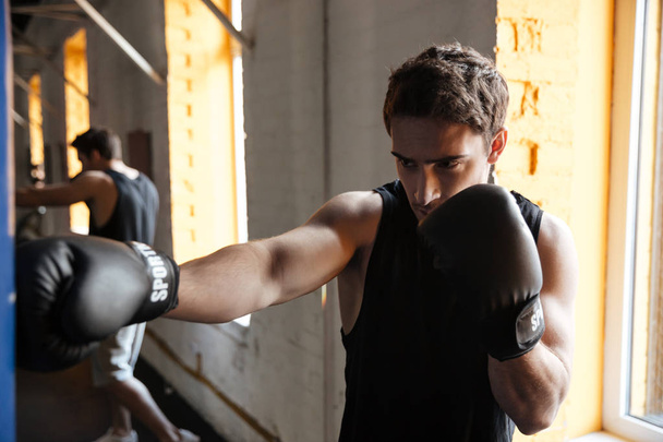 Strong boxer training in a gym - Foto, Imagem