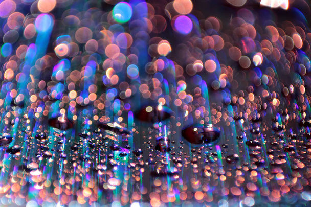 Multicolored water droplets close-up. Beautiful bokeh. - Photo, Image