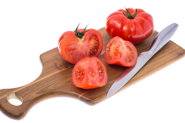 Red tomato on wooden board - Photo, Image