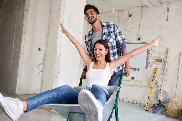 Loving couple is having fun while they are renovating house - Photo, Image