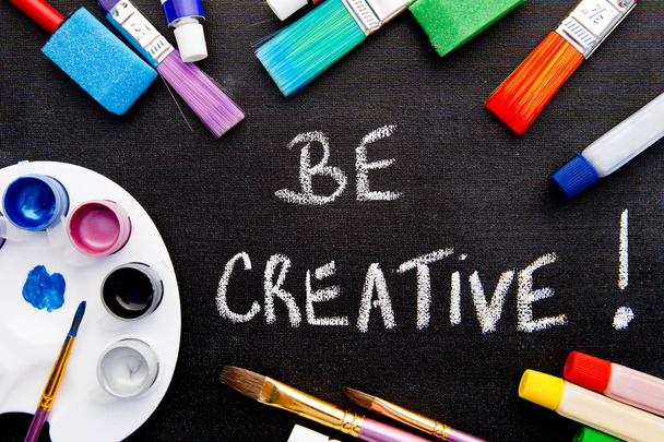 Art - Be Creative handwritten on chalkboard surrounded by art equipment - Photo, Image