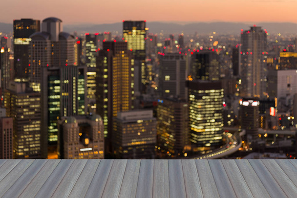 Business building blurred bokeh light at twilight, Osaka Japan, abstract background - Photo, Image