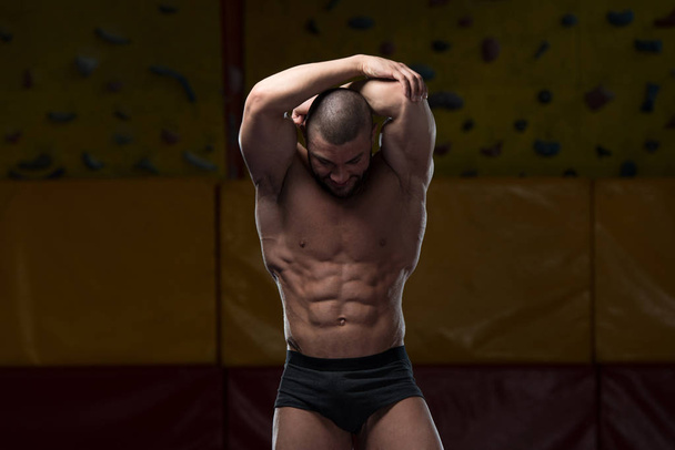 Muscular Body Builder Showing His Front Abdominal Abs - Photo, Image