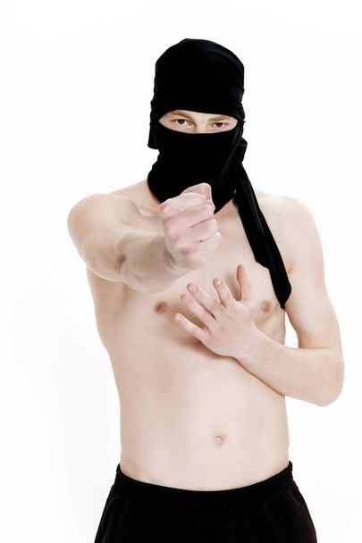 Ninja on white background. Male fighter in black clothes - Zdjęcie, obraz