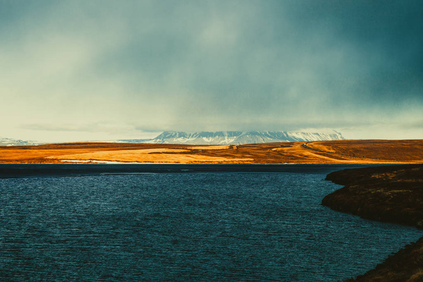 Bright blue lake on stony rocky deserted landscape of Iceland. T - Фото, зображення