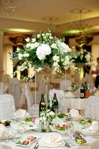 Gorgeous bouquet made of white flowers and greenery stands on wh - Photo, Image