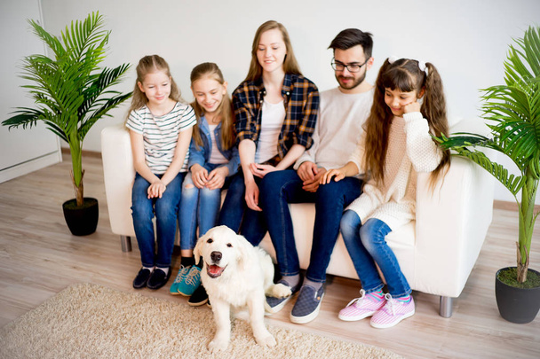 Family playing with a dog - Photo, Image