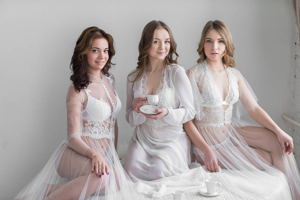 Three sexy girls brides in lingerie - Foto, imagen