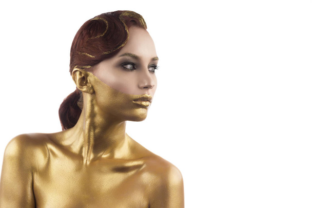 the girl tinted in gold, isolated on a white background - Foto, imagen
