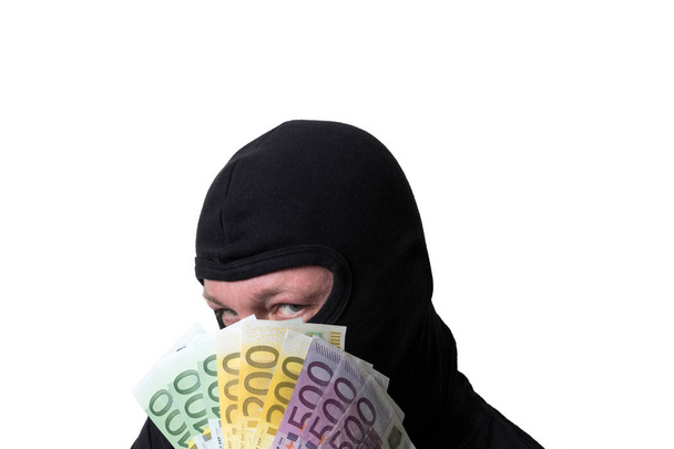 zloděj drží peníze izolovaných na bílém pozadí - Fotografie, Obrázek