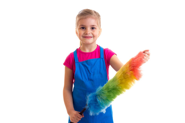 Girl in apron with duster - Foto, Bild
