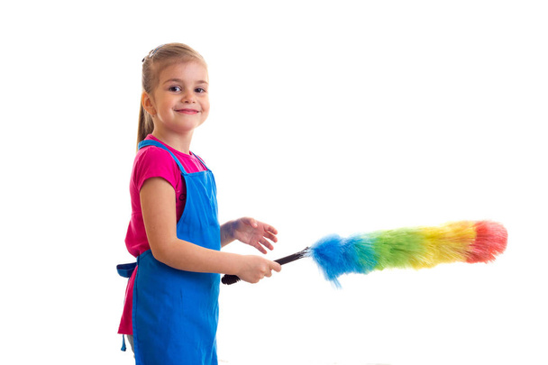 Girl in apron with duster - Photo, Image