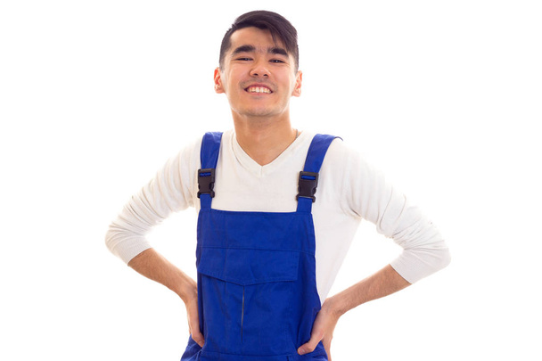 Young man in blue overall - Photo, Image