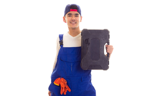 Jonge man in totale bedrijf toolbox - Foto, afbeelding