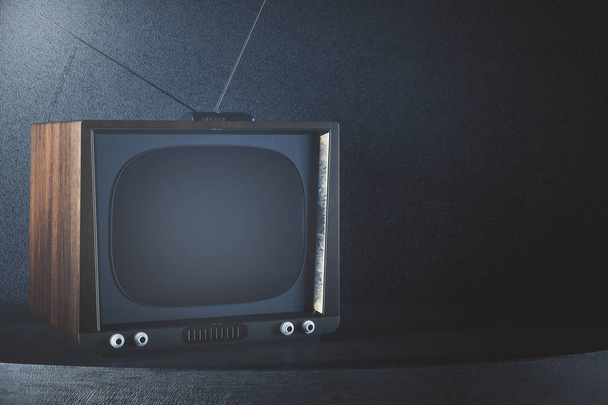 TV obsoleta sobre fondo de hormigón
 - Foto, Imagen