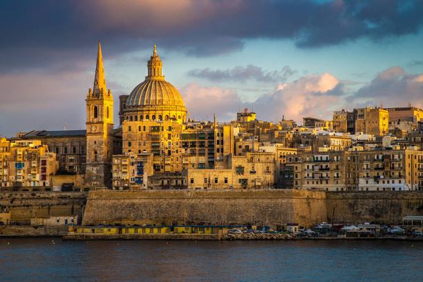 Valletta, Malta - Golden hour at the famous St.Paul's Cathedral and the city of Valletta - Photo, Image