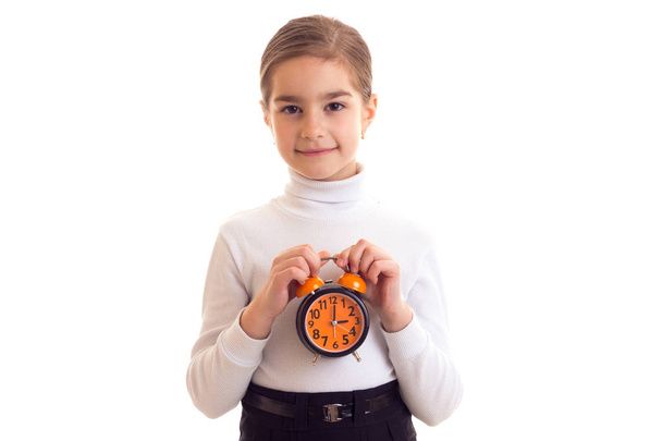 Little girl holding a clock - Photo, Image