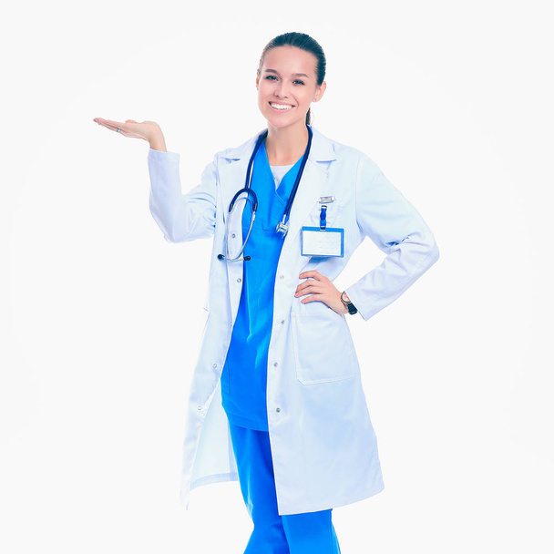 A portrait of a female doctor pointing isolated on white background - Photo, image