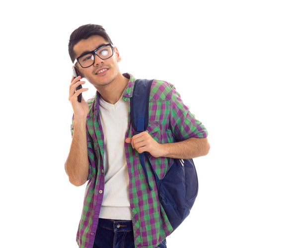 Young man with backpack and smartphone - Foto, Bild