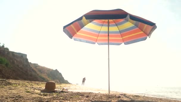 Umbrella on the shore. - Footage, Video