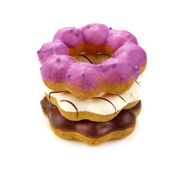 birçok renkli donuts bir başka üzerine topluluğu - Fotoğraf, Görsel