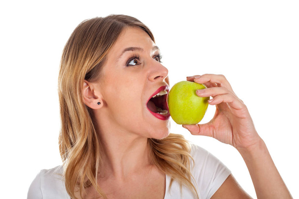 Young girl on diet holding a green apple - Photo, image