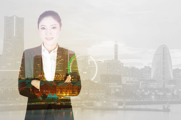 double exposure of  business woman crossed arms with city backgr - Photo, Image