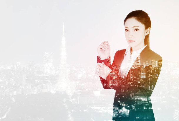 double exposure of business woman is dressing up with city backg - Photo, Image