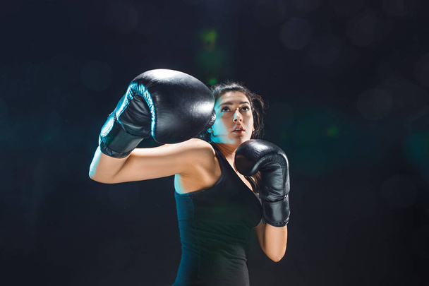The female boxer training at sport club - Foto, Imagen