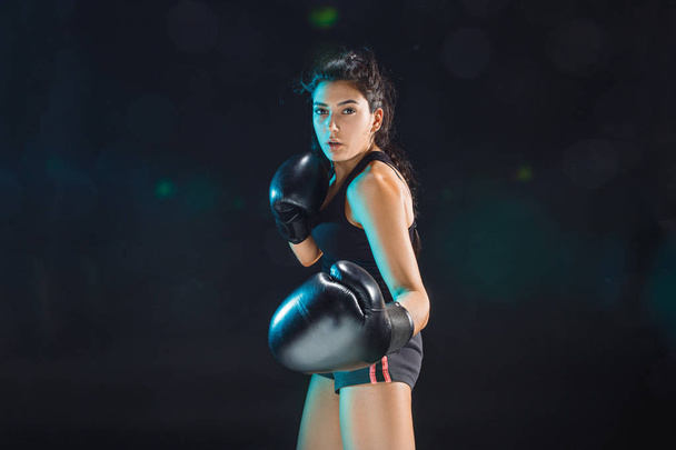 The female boxer training at sport club - Foto, imagen